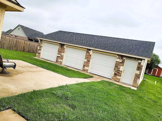 garage with a yard