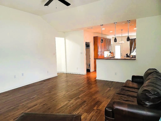 unfurnished living room with ceiling fan, dark hardwood / wood-style floors, and lofted ceiling