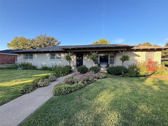 ranch-style home with a front yard