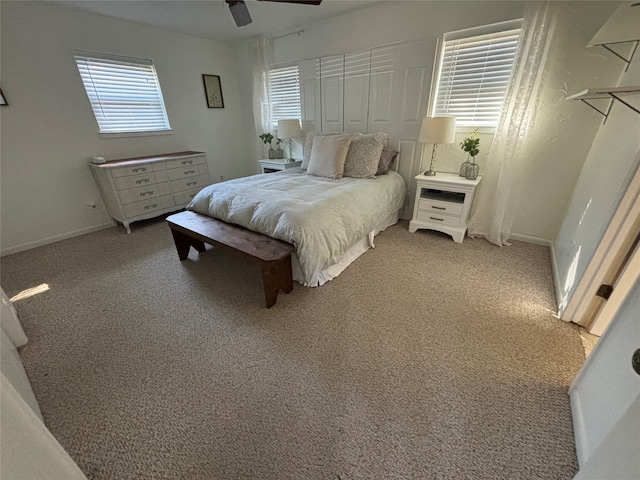 carpeted bedroom featuring ceiling fan