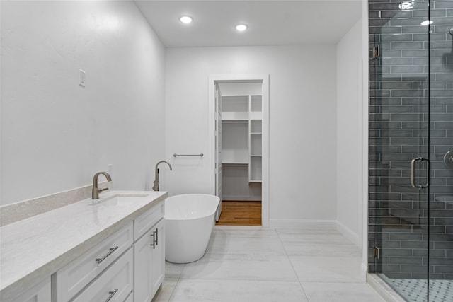 bathroom featuring vanity and plus walk in shower