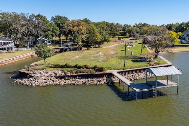 dock area with a water view and a yard