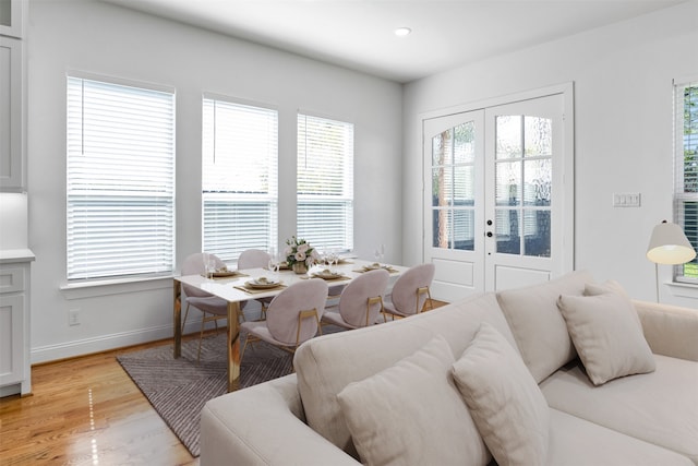 interior space with french doors, light wood-type flooring, and plenty of natural light