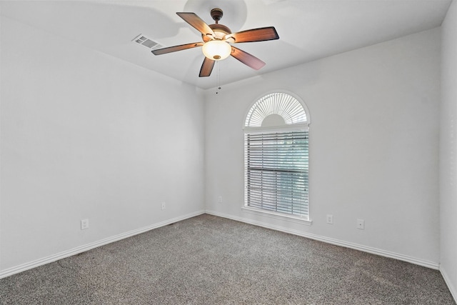 unfurnished room with carpet and ceiling fan