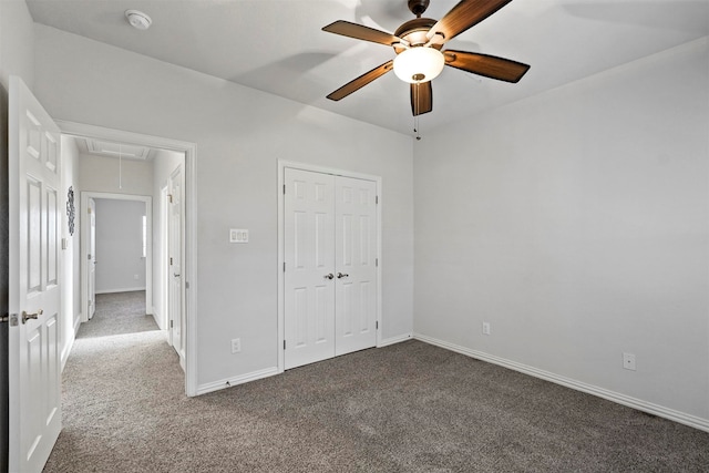 unfurnished bedroom featuring carpet, ceiling fan, and a closet