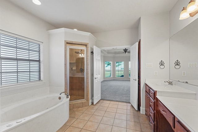 bathroom featuring ornamental molding, vanity, independent shower and bath, tile patterned flooring, and ceiling fan