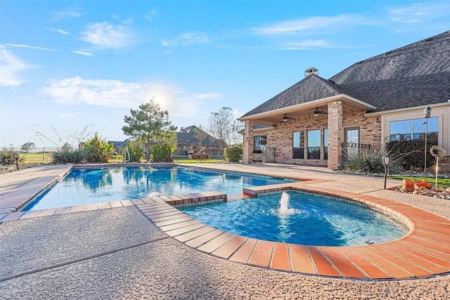 view of swimming pool with a patio area and ceiling fan