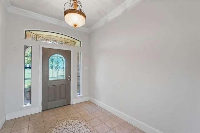 tiled foyer entrance featuring crown molding