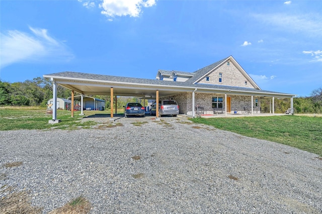 farmhouse-style home with a front lawn and a carport