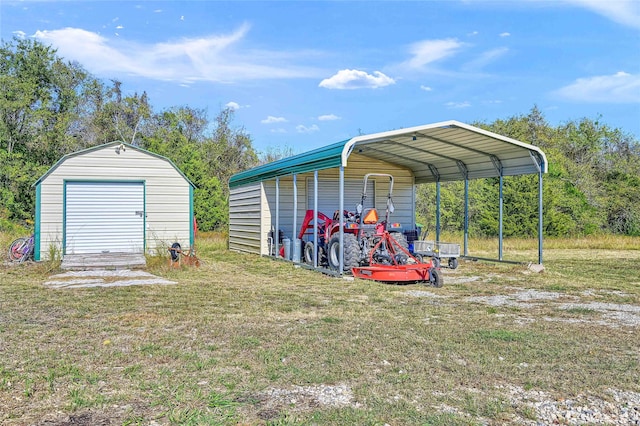 view of outbuilding with a garage, a lawn, and a carport