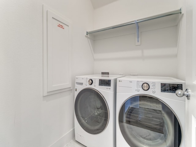 laundry area with separate washer and dryer