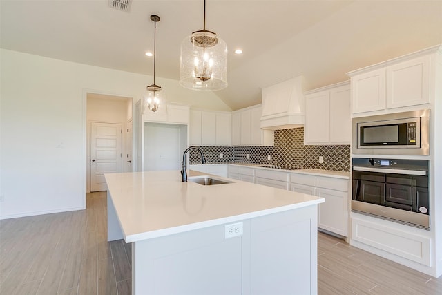 kitchen featuring white cabinetry, appliances with stainless steel finishes, and sink