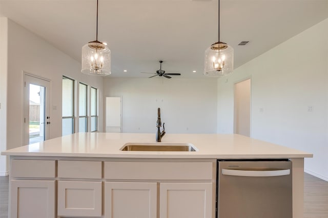 kitchen with an island with sink, white cabinetry, sink, and dishwasher