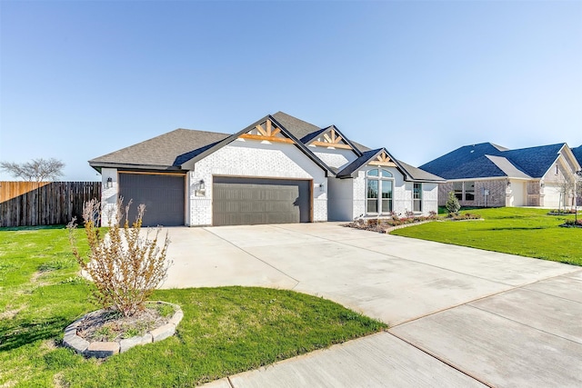 view of front of house with a garage and a front yard