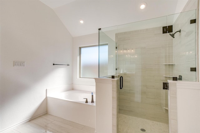 bathroom with lofted ceiling, tile patterned floors, and separate shower and tub