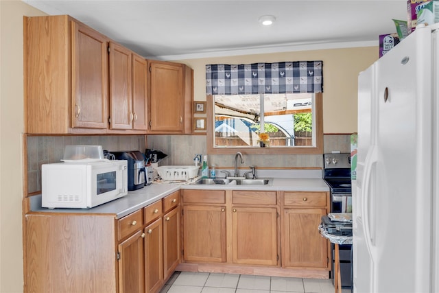 kitchen featuring sink, tasteful backsplash, light tile patterned floors, white appliances, and crown molding