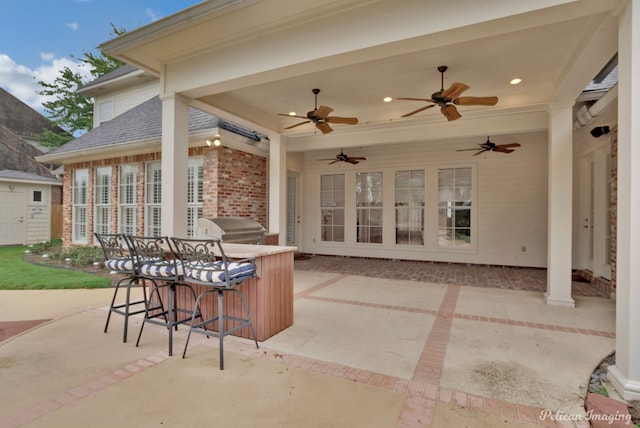 view of patio / terrace featuring ceiling fan, area for grilling, and french doors