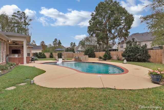 view of pool featuring a patio, a lawn, ceiling fan, and pool water feature