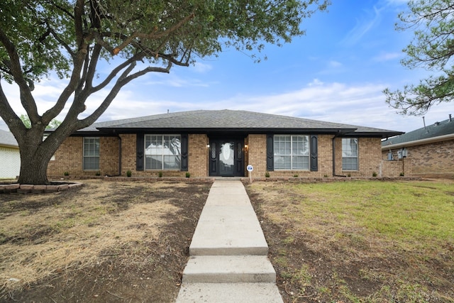 ranch-style house with a front yard