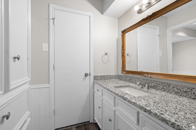 bathroom featuring wood-type flooring and vanity