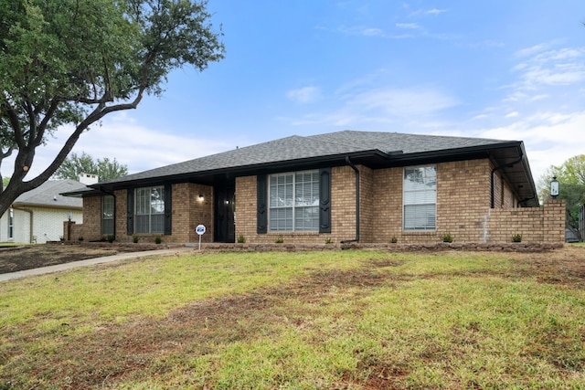 ranch-style home featuring a front yard