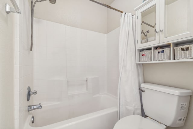 bathroom with shower / tub combo and toilet