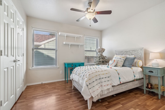 bedroom with hardwood / wood-style floors and ceiling fan