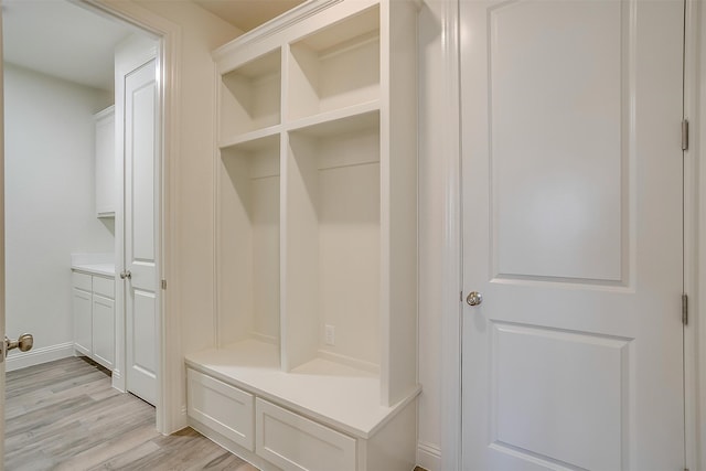 mudroom with light hardwood / wood-style flooring