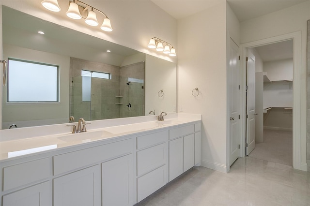 bathroom with vanity and a shower with door