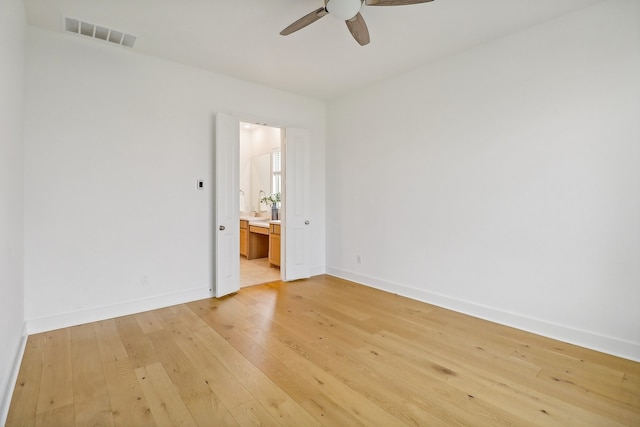 unfurnished room featuring ceiling fan and light hardwood / wood-style flooring