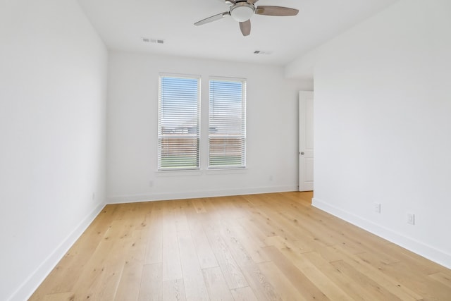 spare room featuring light hardwood / wood-style floors and ceiling fan