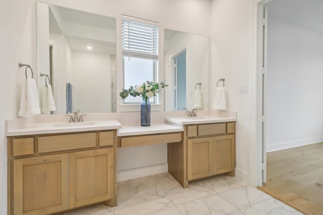 bathroom with hardwood / wood-style floors and vanity