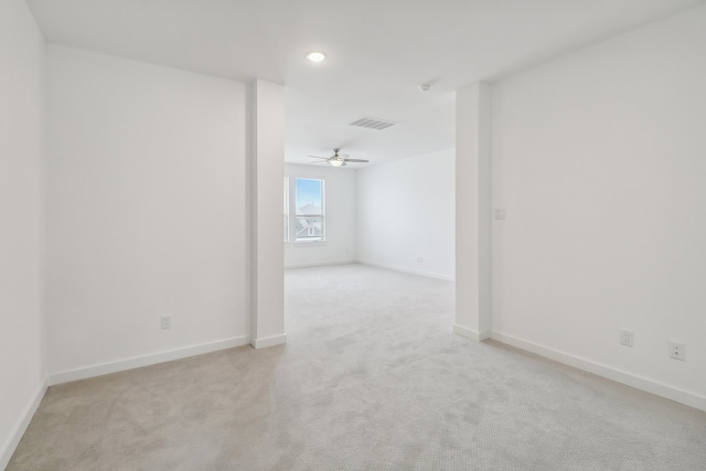 carpeted empty room featuring ceiling fan