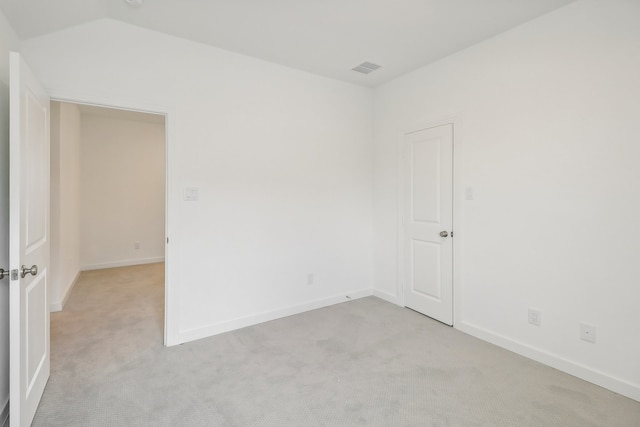 empty room featuring light colored carpet