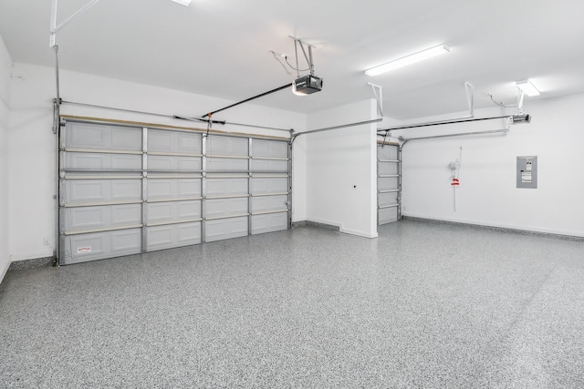 garage with a garage door opener and electric panel