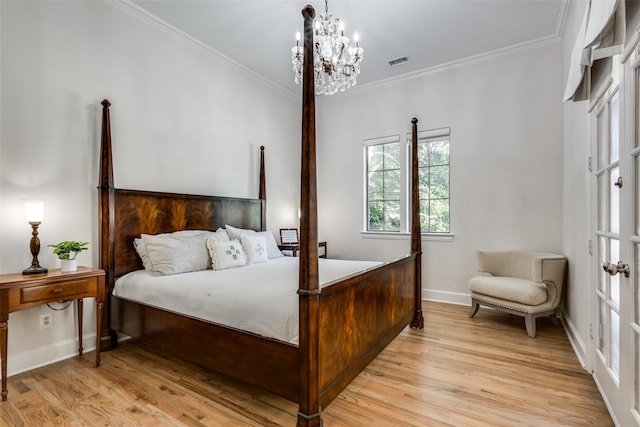 bedroom featuring an inviting chandelier, light wood-type flooring, and crown molding