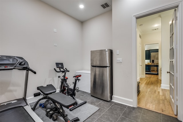 exercise room featuring dark wood-type flooring