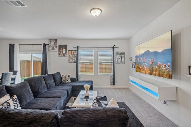 living room featuring light carpet