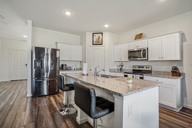 kitchen with white cabinetry, sink, and appliances with stainless steel finishes