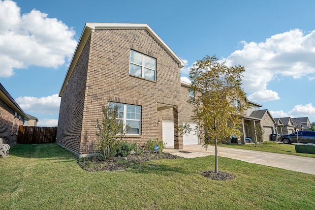 view of front of property with a garage and a front yard