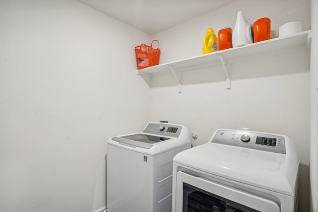 laundry room with washer and clothes dryer