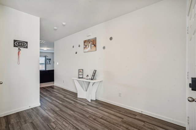 interior space with dark hardwood / wood-style flooring