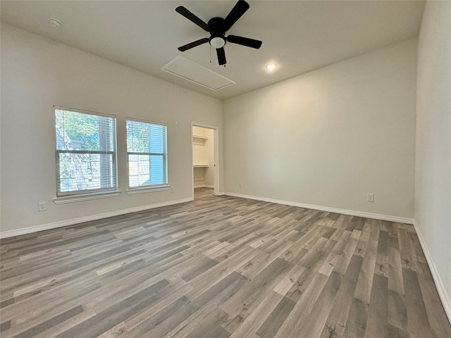 209 Smith St, Hillsboro, TX 76645 - spare room featuring attic access, a ceiling fan, wood finished floors, baseboards, and recessed lighting