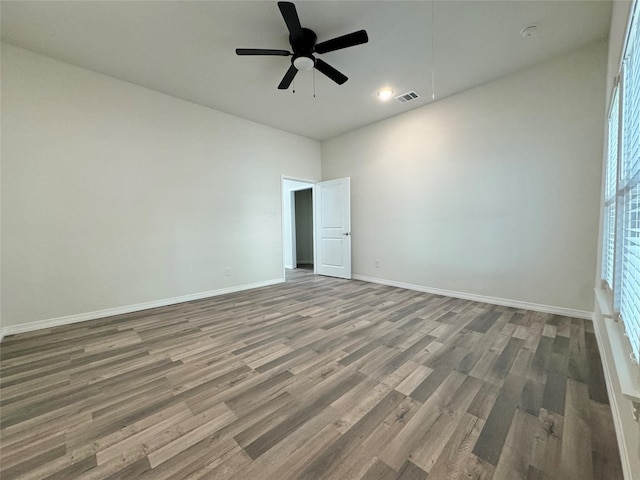 209 Smith St, Hillsboro, TX 76645 - spare room featuring wood finished floors, baseboards, ceiling fan, and recessed lighting