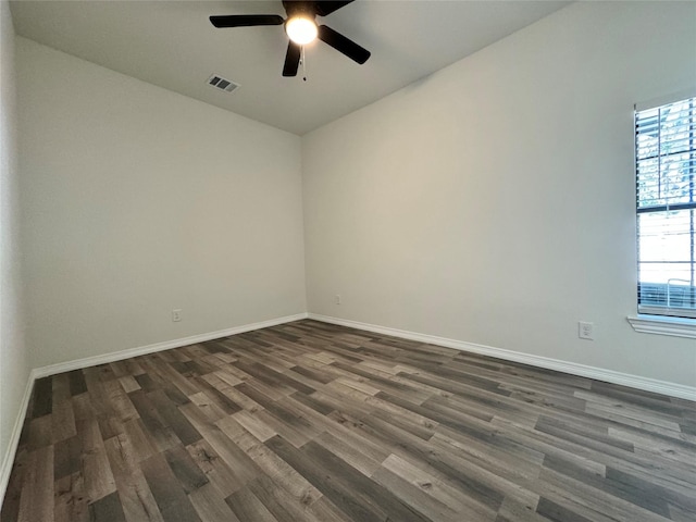 209 Smith St, Hillsboro, TX 76645 - spare room featuring a ceiling fan, dark wood finished floors, and baseboards