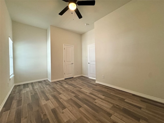209 Smith St, Hillsboro, TX 76645 - unfurnished bedroom featuring dark wood-type flooring, baseboards, and ceiling fan