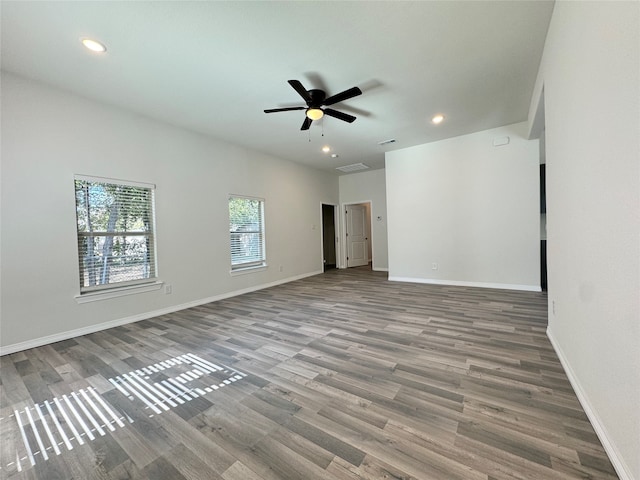 empty room featuring wood-type flooring and ceiling fan