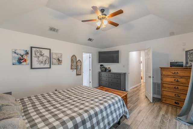 bedroom with light wood-type flooring, lofted ceiling, and ceiling fan