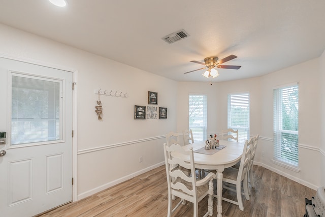 dining room with ceiling fan and light hardwood / wood-style flooring