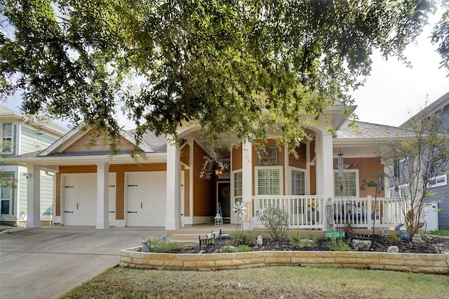 view of front of home with a garage and covered porch